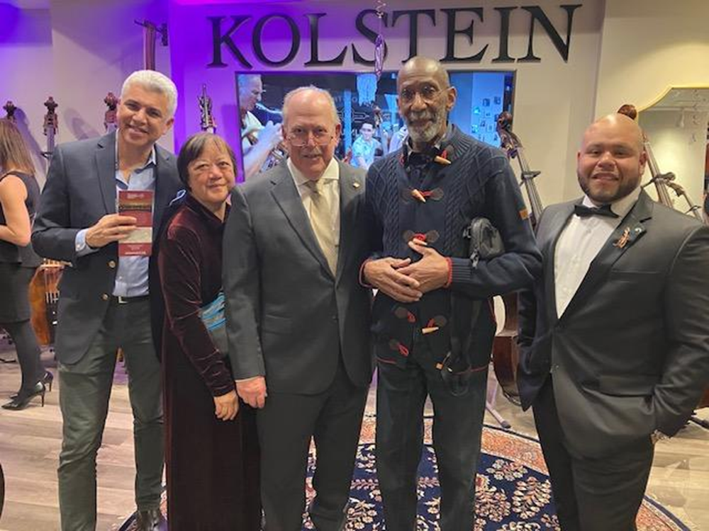 Kolstein President Manny Alvarez (right) together with Barrie Kolstein (center) greet some of their 80 th anniversary celebration guests: (left to right) jazz bassist Saadi Zain, Dr. Yeou Cheng Ma from the Children’s Orchestra Society, and jazz bassist Ron Carter
